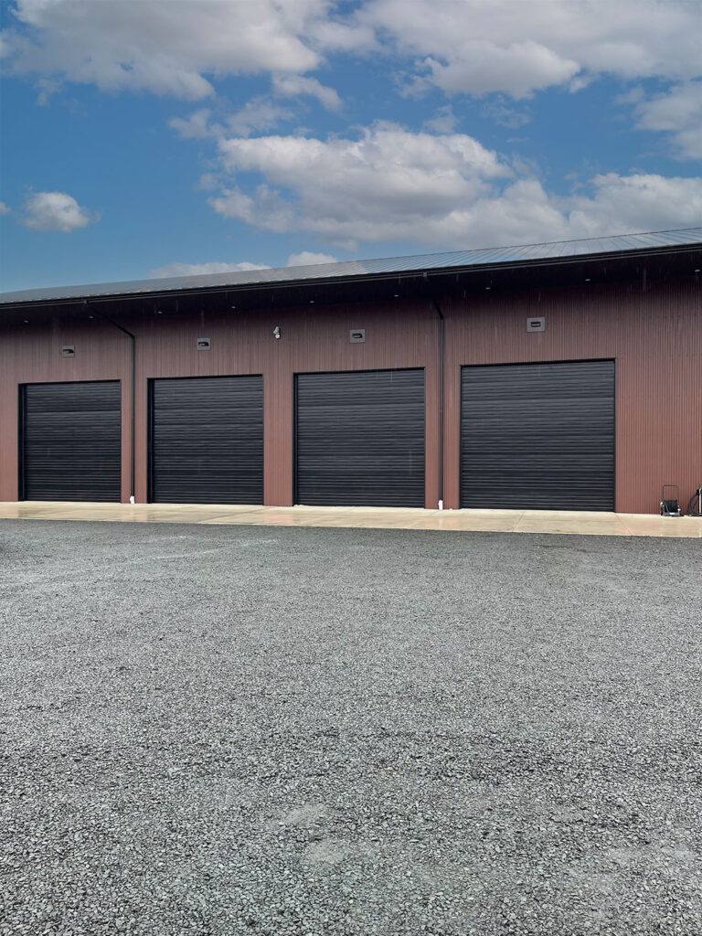 Three bronze commercial rolling steel doors installed by Crawford Windor