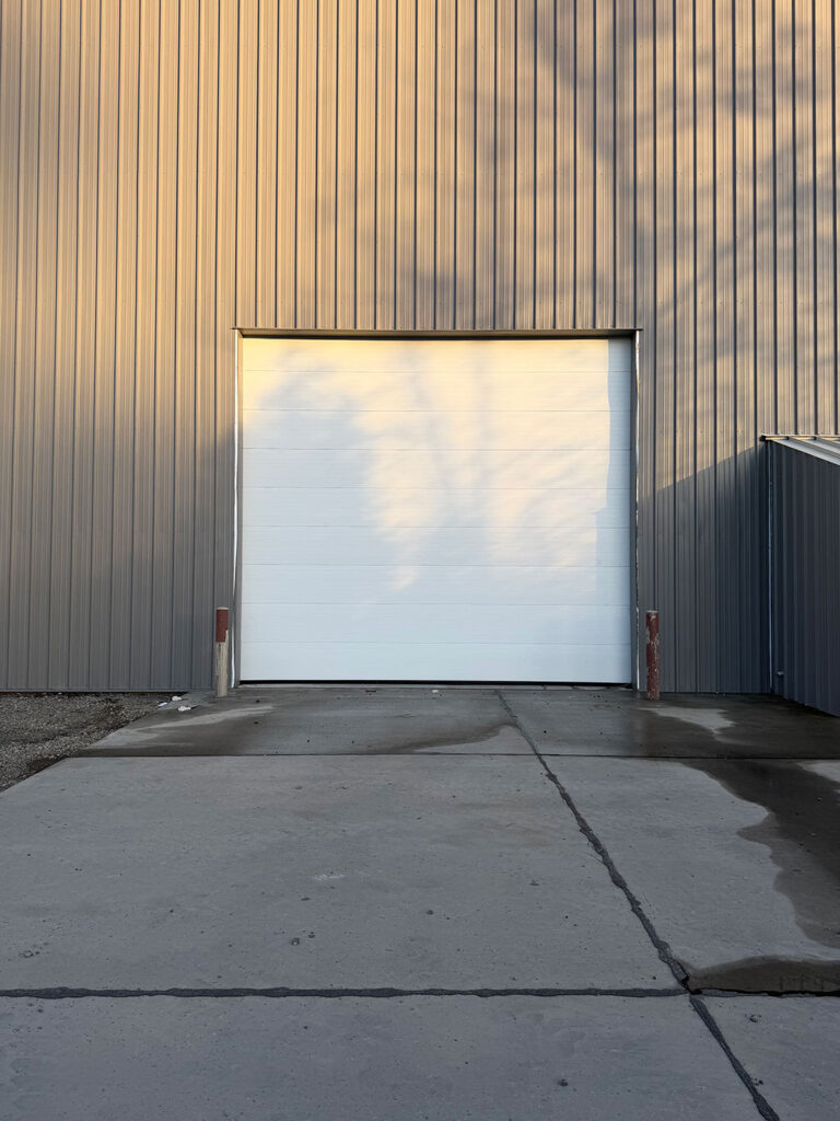 White sectional garage door on a commercial building in Eugene, Oregon