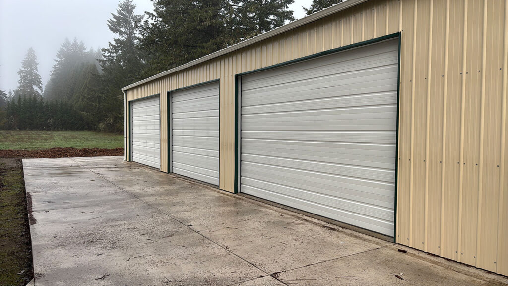 Insulated garage doors on an attached three-bay garage near Eugene, Oregon