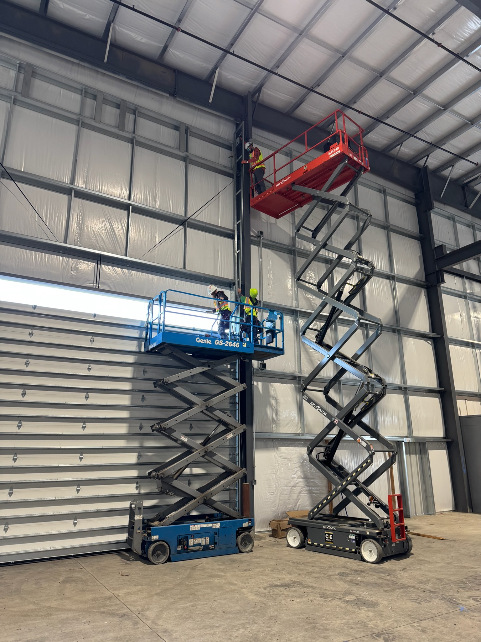 Crawford Windor crew during a commercial garage door installation in a steel building near Eugene, Oregon