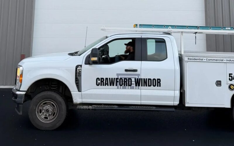 Crawford Windor garage door repair truck parked at a commercial job in Eugene, Oregon