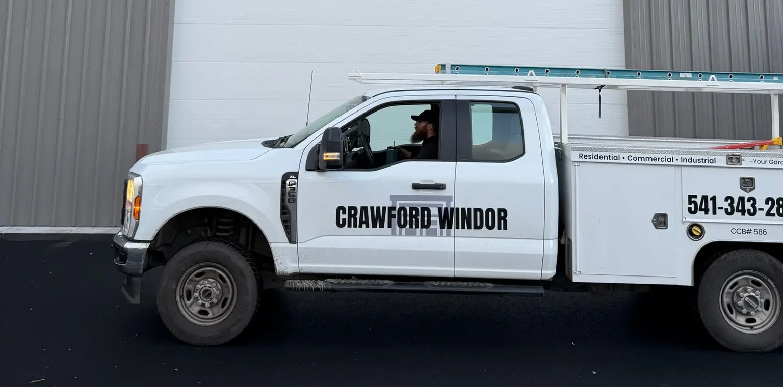 Crawford Windor garage door repair truck parked at a commercial job in Eugene, Oregon