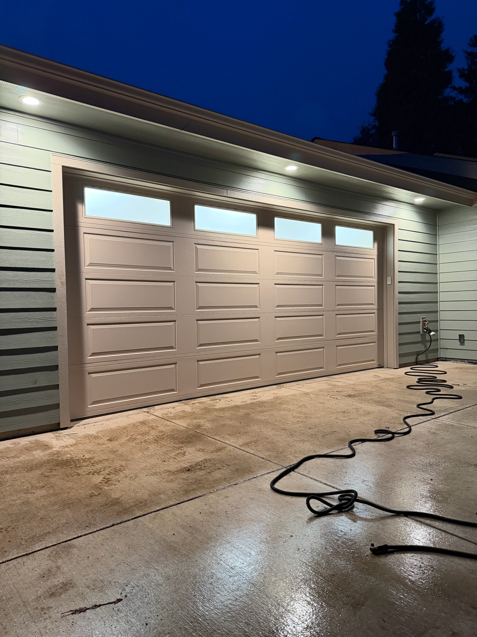Contemporary garage door on a Lane County home fitted with a smart garage door opener