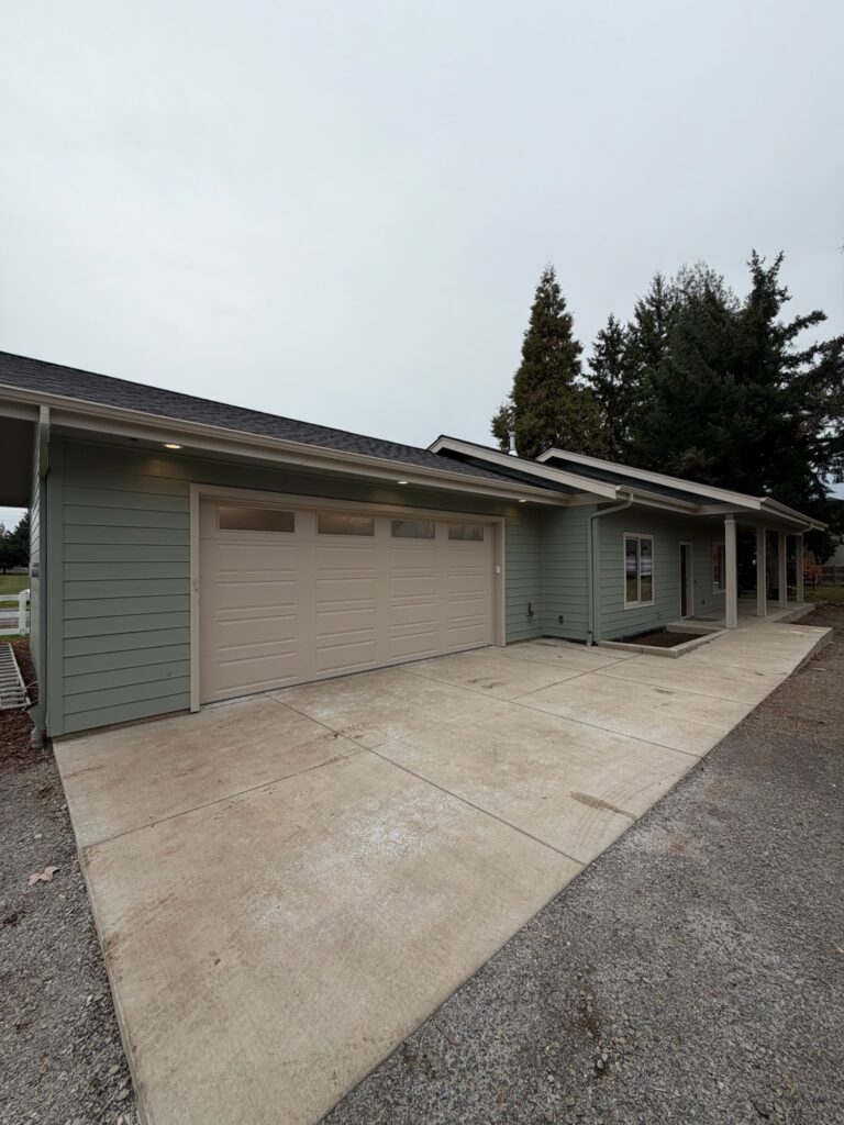 Home near Eugene, Oregon with a garage door in the condition regular garage door maintenance keeps them in