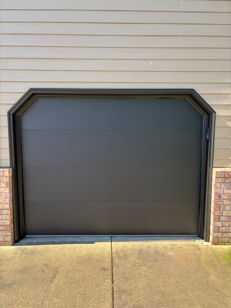 Contemporary flush-panel garage door fitted with a quiet belt drive smart opener, Eugene Oregon